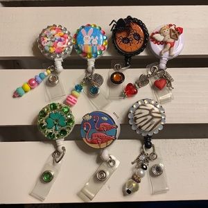 Lot of 7 Badge Reels